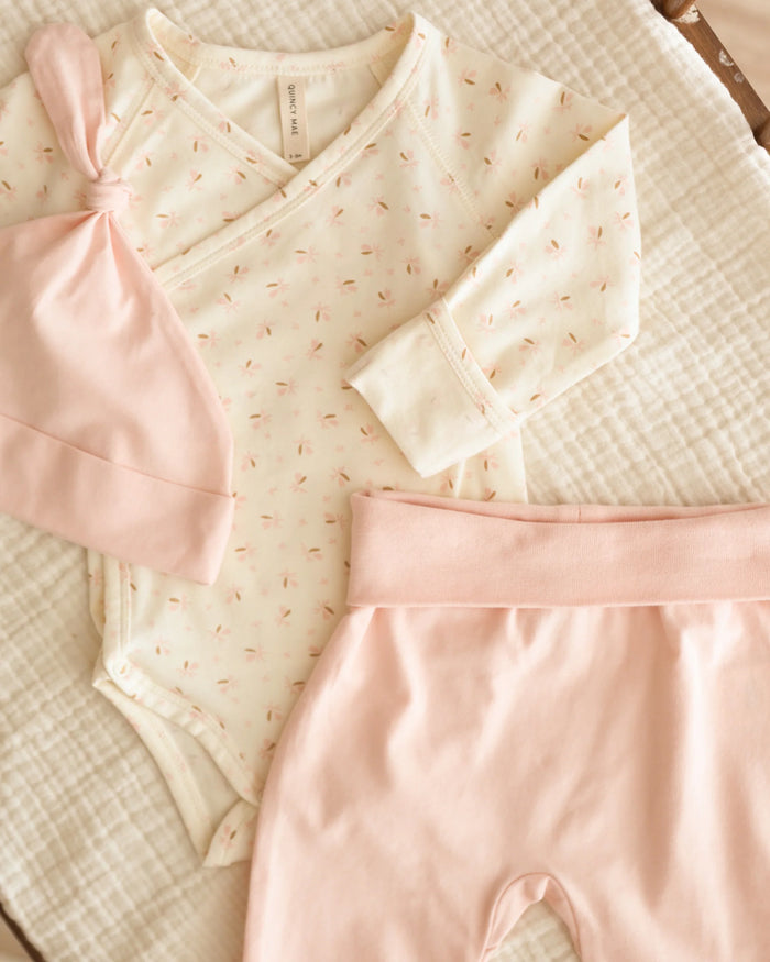 QM side snap bodysuit in ivory